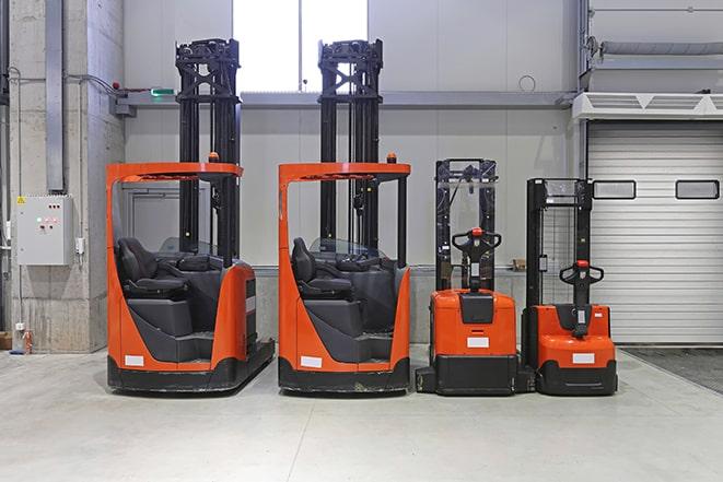 industrial forklifts parked in a manufacturing facility